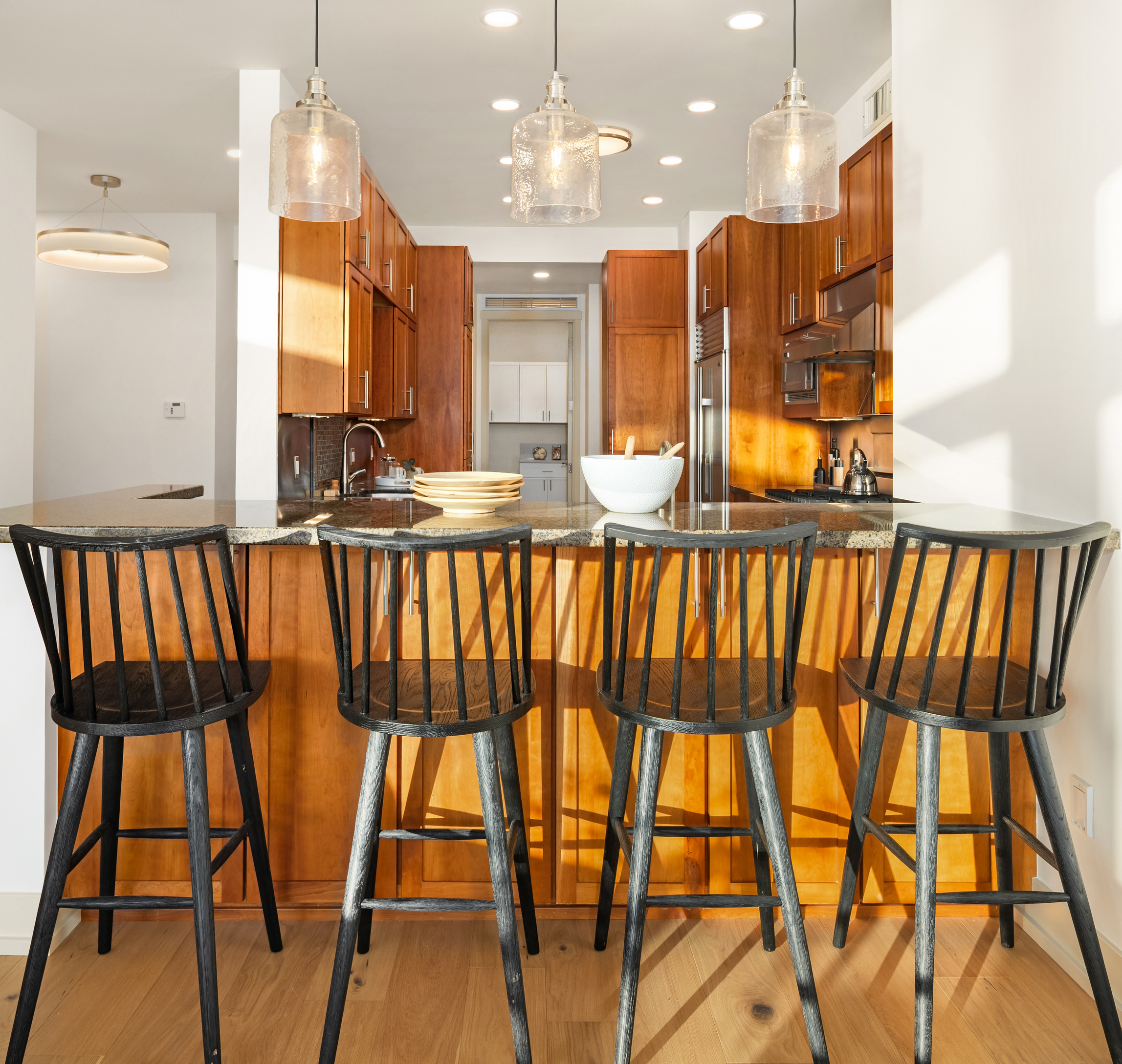 Kitchen island with seating and pendant lights